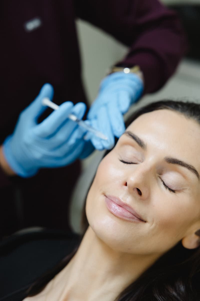 a woman getting botox injection