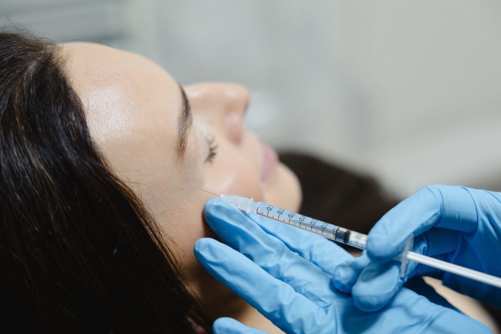 a woman getting botox injection