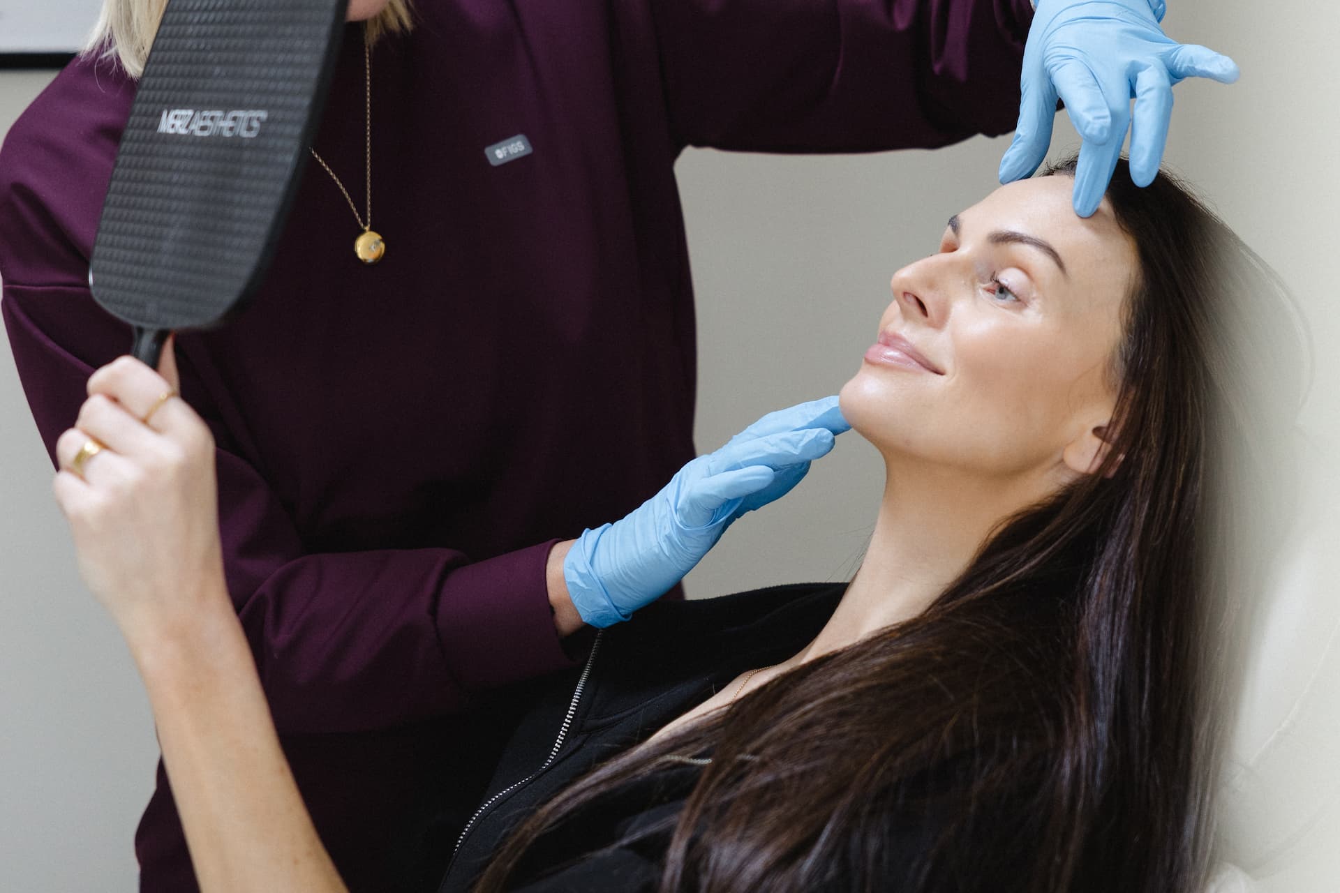 a woman getting a facial massage