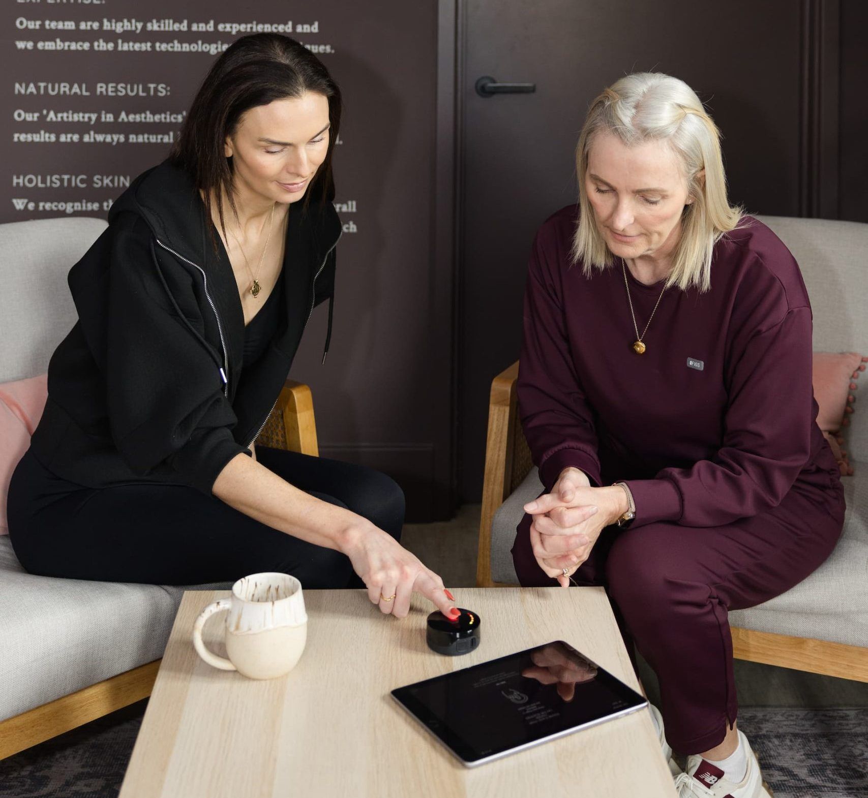 a woman looking at a tablet