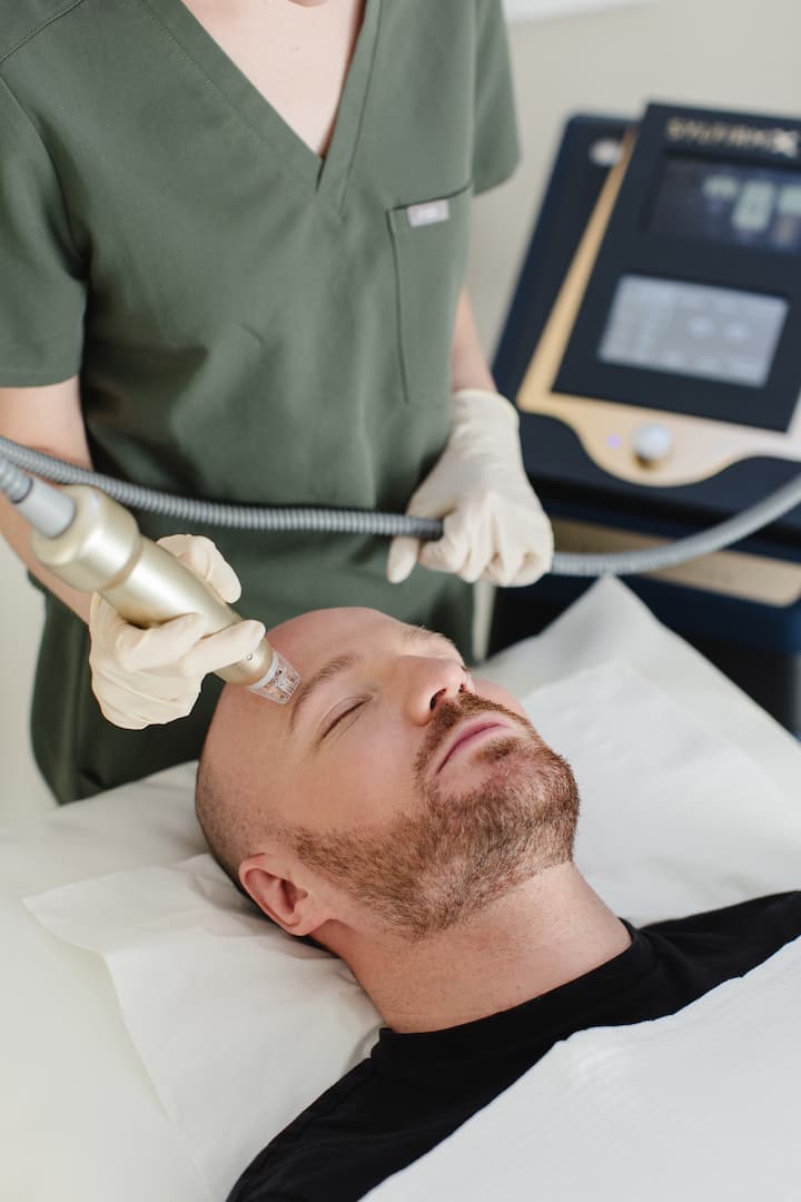 a man receiving a facial massage
