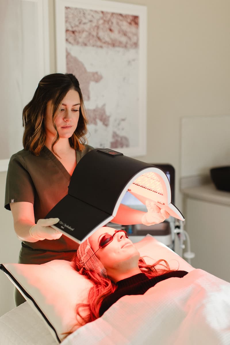 a woman getting a light therapy treatment