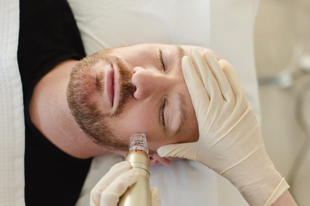 a man receiving a facial massage